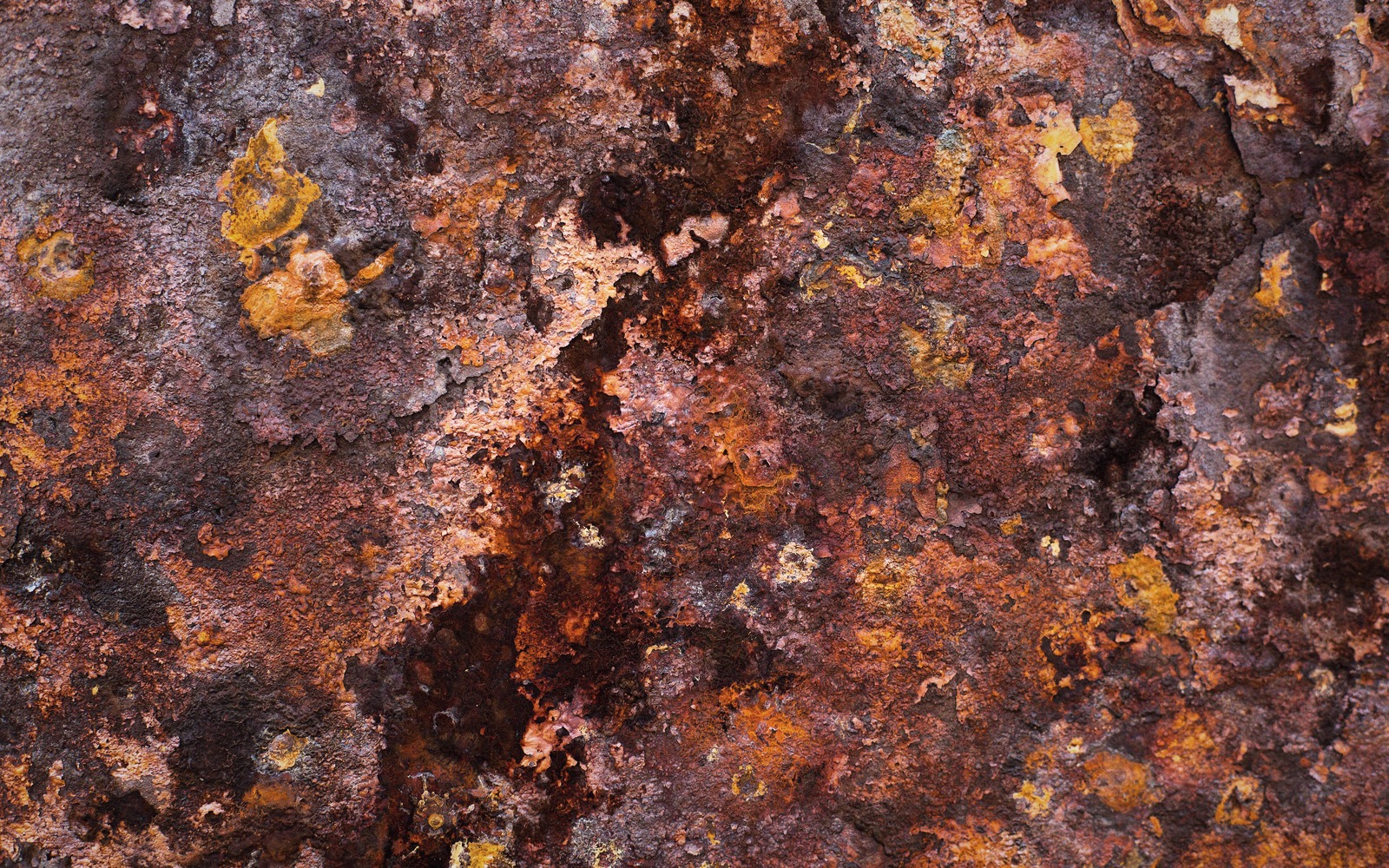 Corrosion is a circuit, not a decay. Saltwater supplies the electrolyte; a riveted seam supplies the geometry.
